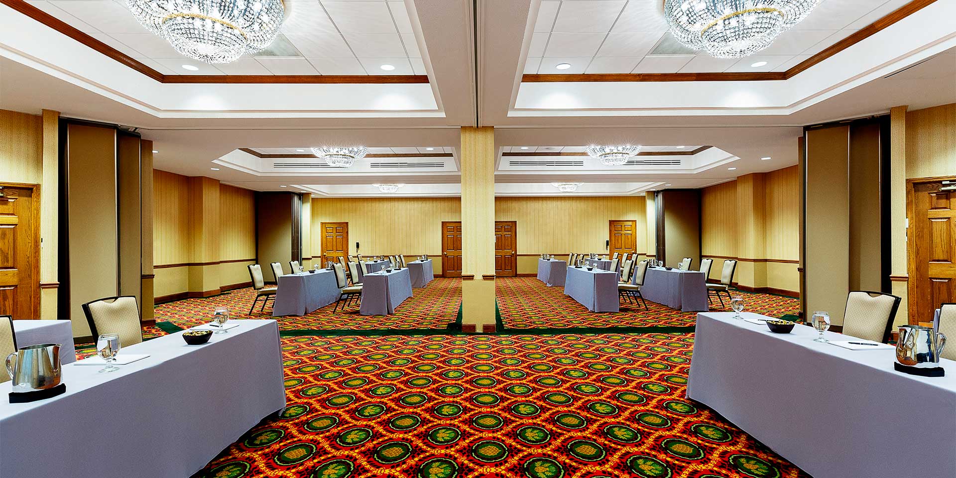 large room with tables facing each other