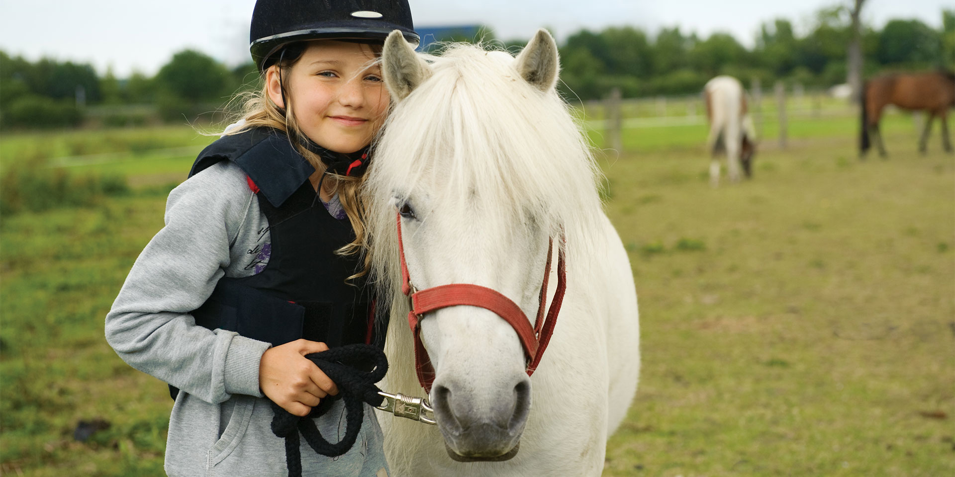 young girl with white pony