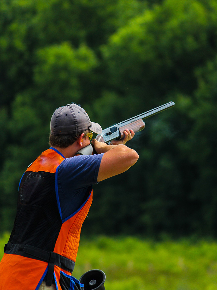 man shooting clays