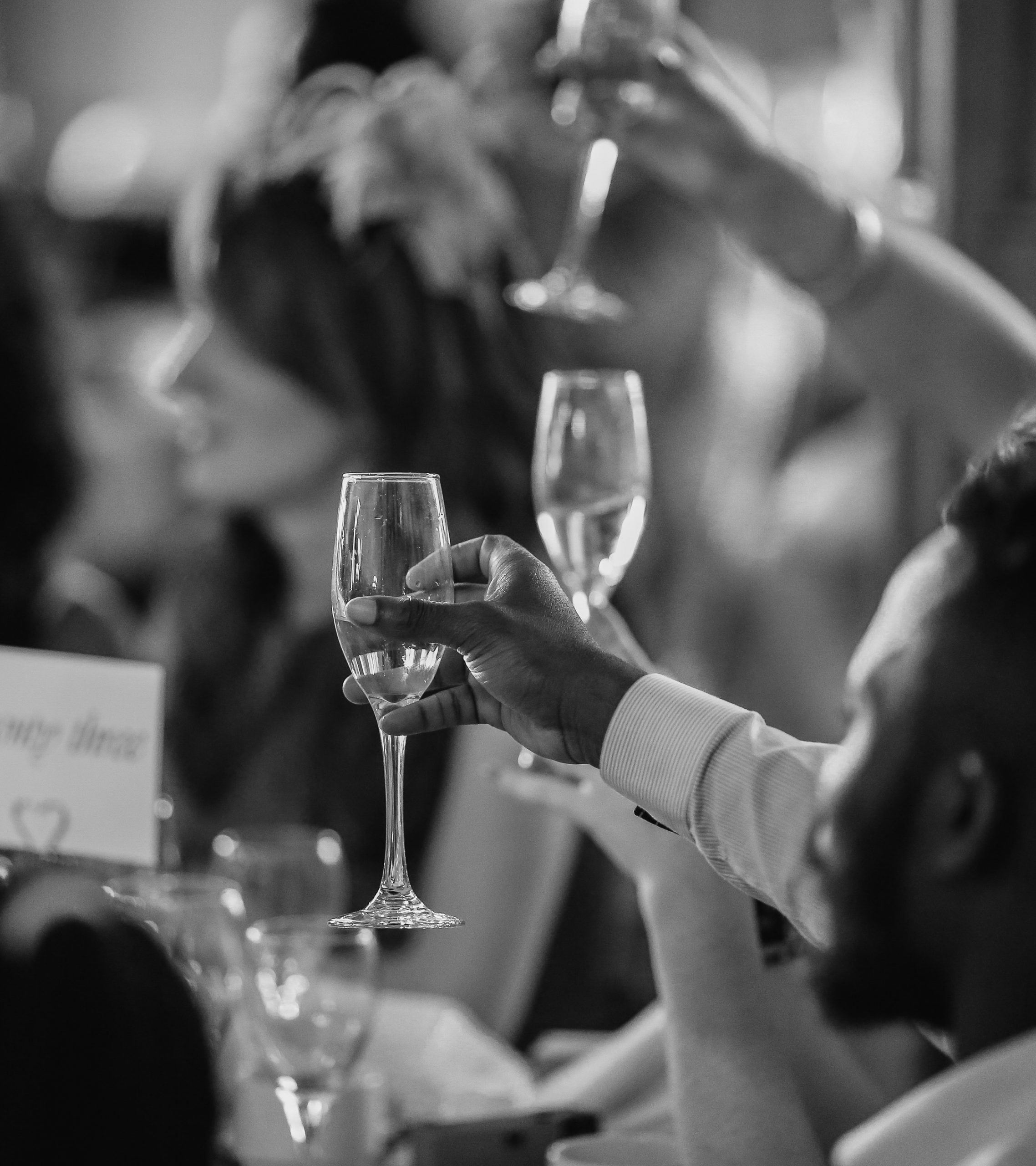 People raising a glass at an event