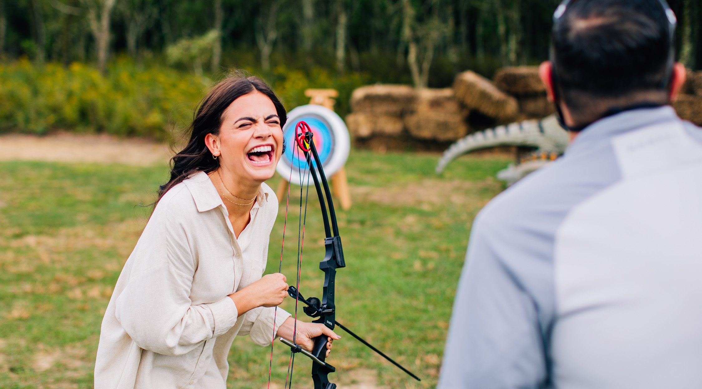 Woman with a bow and arrow at The Field Club