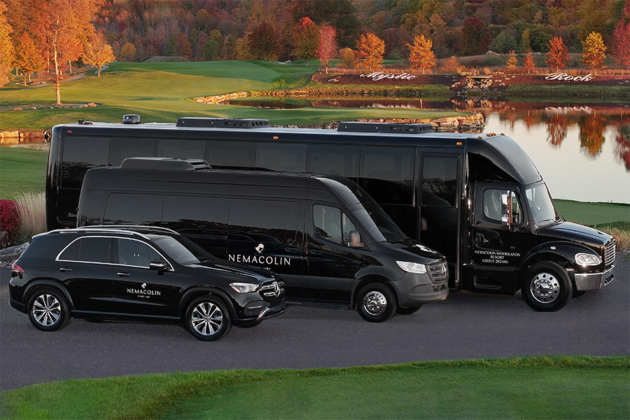 vehicles parked next to a golf course