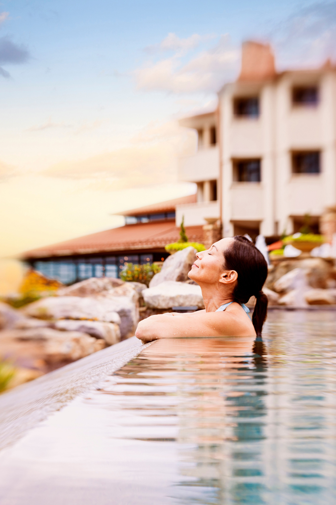Click here to open the gallery overlay for the image: woman in an infinity pool