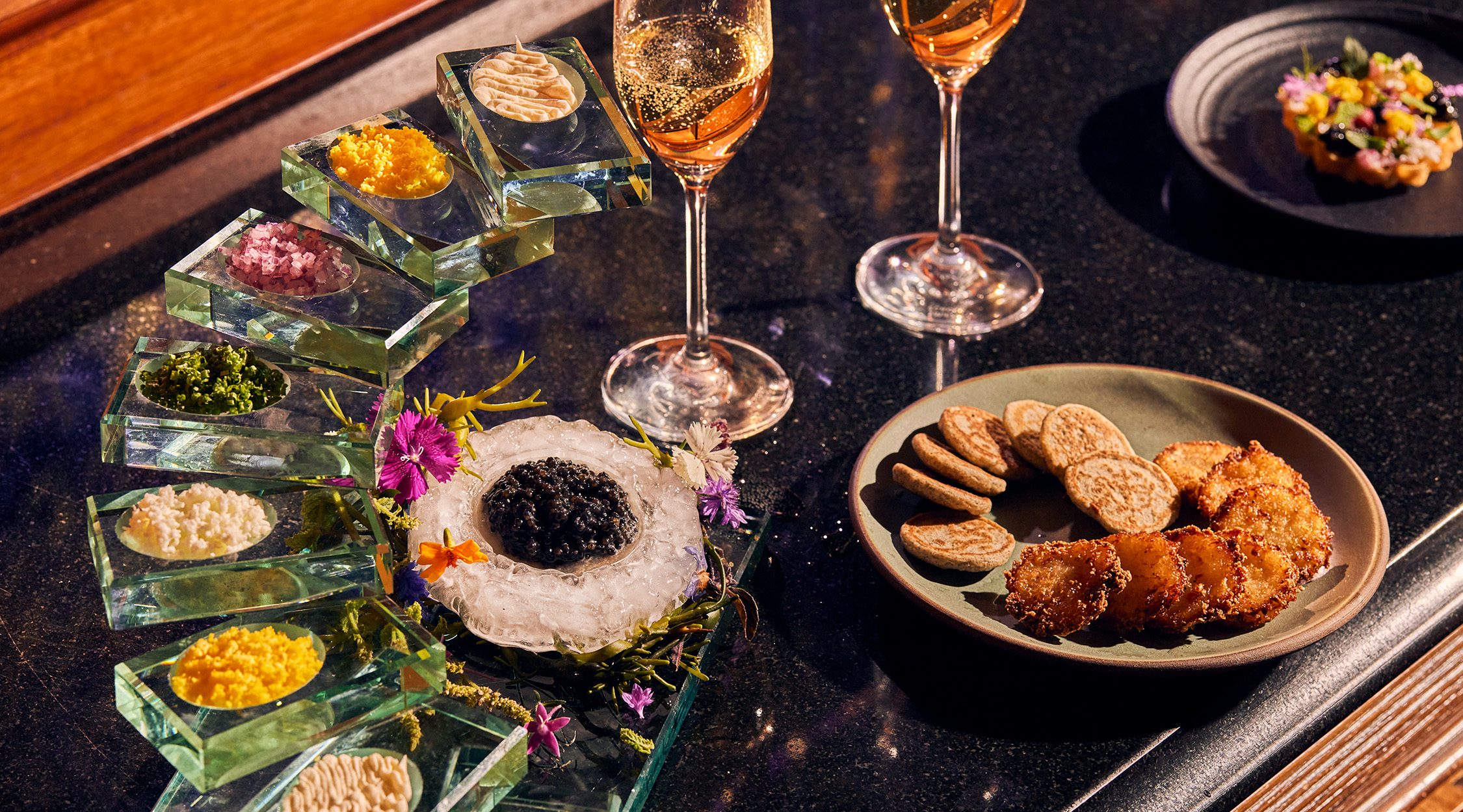 Various small plate food items and wine offered at the Forbes Five-Star Lautrec restaurant at Nemacolin resort