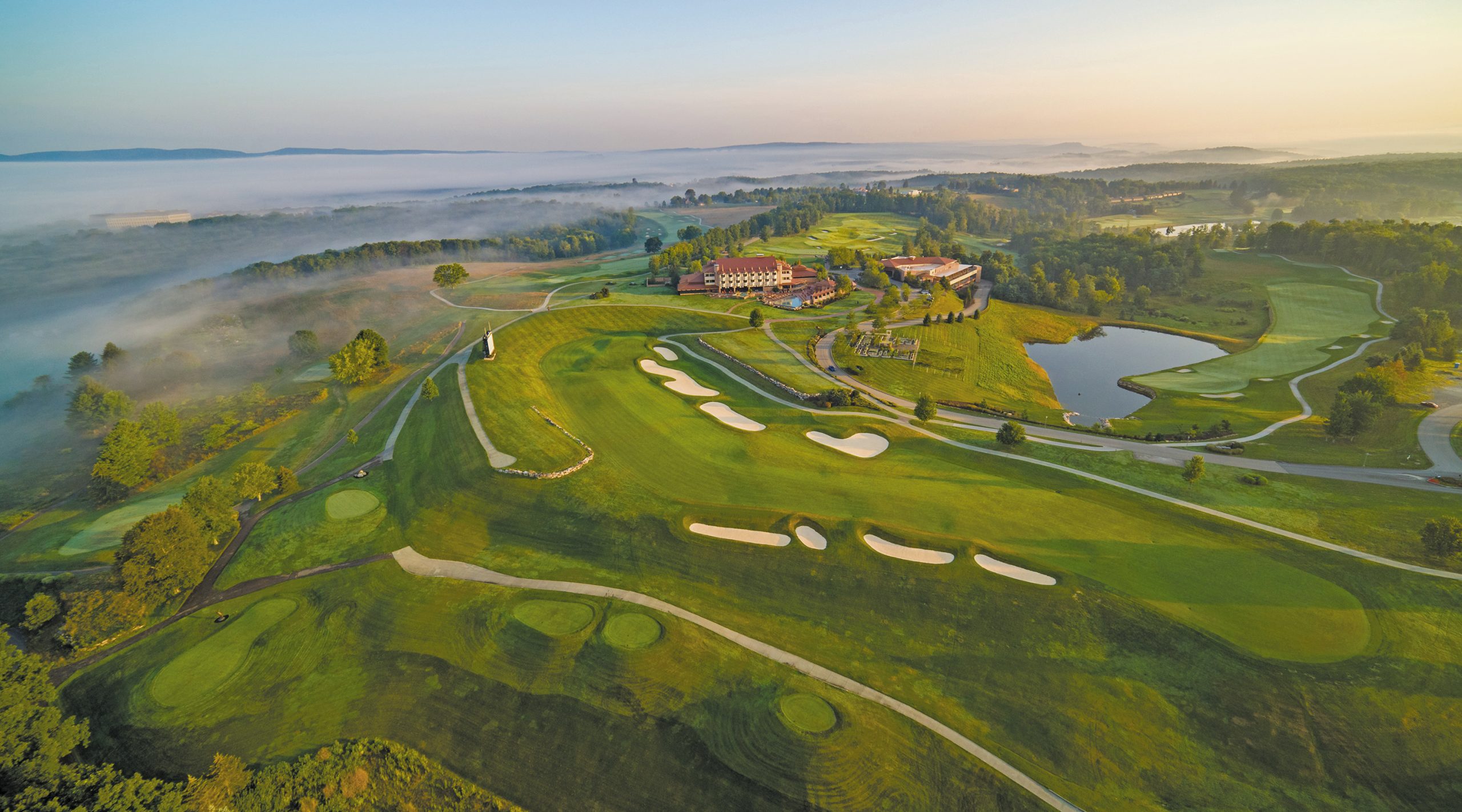 Aerial mountain view of the Falling Rock hotel and golf course at Nemacolin resort